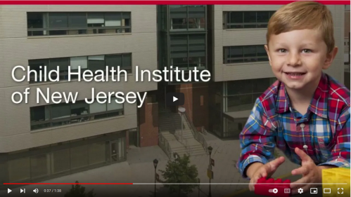 Screenshot of a video still showing a young child playing with the words Child Health Institute of New Jersey to their left.